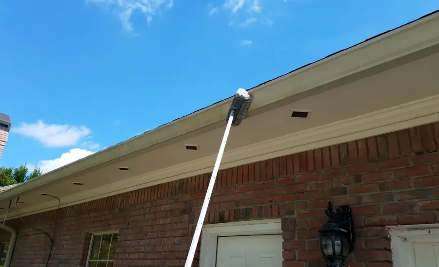 Clean eave and gutter line on a brick elevation after a Jacksonville gutter inspection
